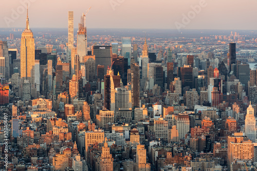 Fototapeta Naklejka Na Ścianę i Meble -  Golden Light Trails Along Midtown Manhattan Skyscrapers, New York City