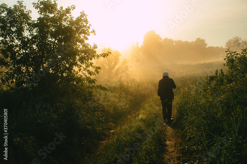 silhouette of a man running in the sunset © Evgenii Ryzhenkov