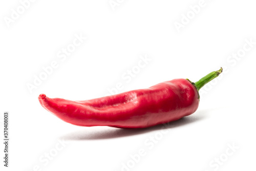 Red hot pepper isolated on white background. Acute spice for food.