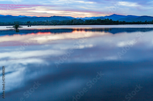 mountains of the Blue Ridge reflect in Lake Wilson after heavy rain