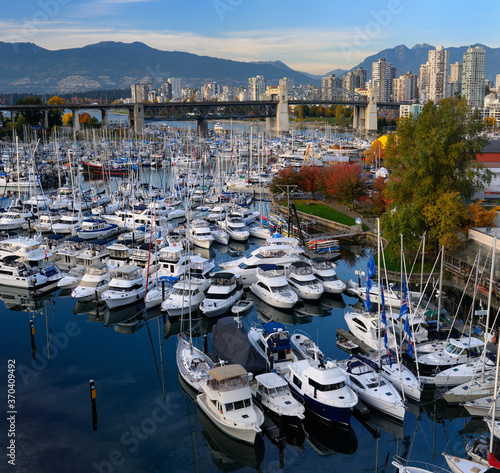 Boats moored at Granville Island Boat Yard and Burrard Marina with bridge and Coastal mountains Vancouver © Reimar