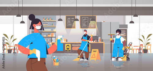 mix race cleaners in masks disinfecting coronavirus cells in cafe to prevent covid-19 pandemic cleaning service disinfection control of epidemic concept horizontal full length vector illustration