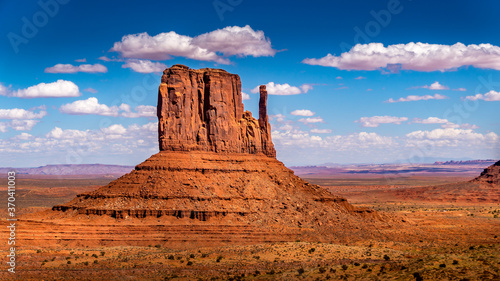 The towering red sandstone formation of West Mitten Butte in the Navajo Nation's Monument Valley Navajo Tribal Park on the border of Arizona and Utah, United States