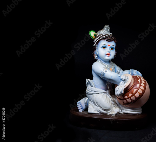 Fotografie Cute and innocent idol of Hindu God Lord Krishna
