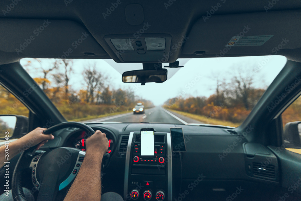 phone with white screen at car dashboard autumn speedway phone with white screen at car dashboard autumn speedway