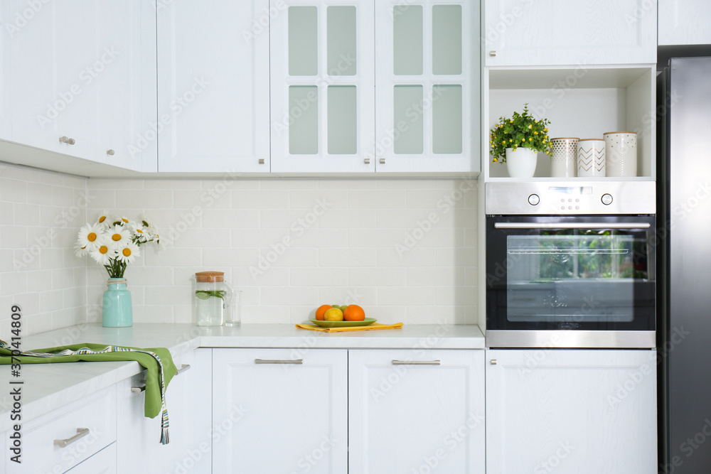 Modern kitchen interior with stylish white furniture Modern kitchen interior with stylish white furniture