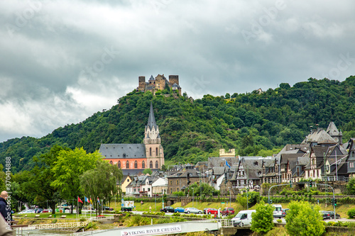 A church in the village of Oberwesel and the Schonburg Castle  along the Rhine river  in Germany