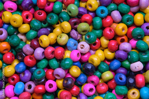 Various sewing Colorful wooden beads as background