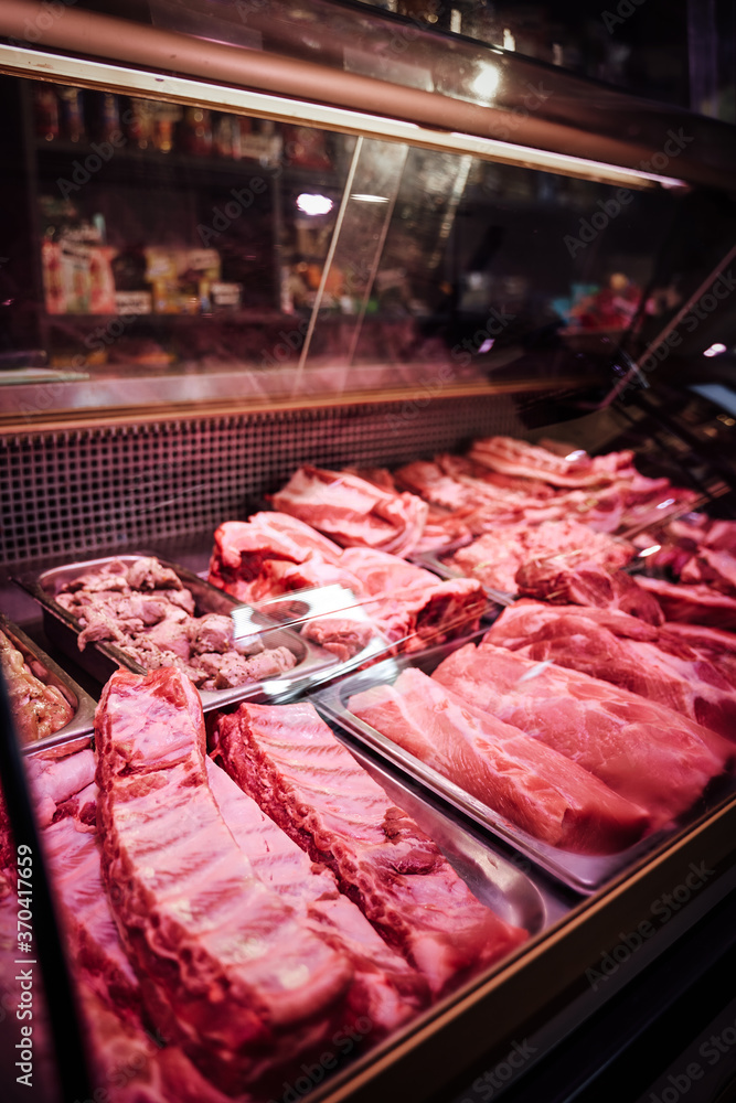 Freshness raw meat market showcase. Fat cool food storage. Cut meat sale. Fresh steaks counter.