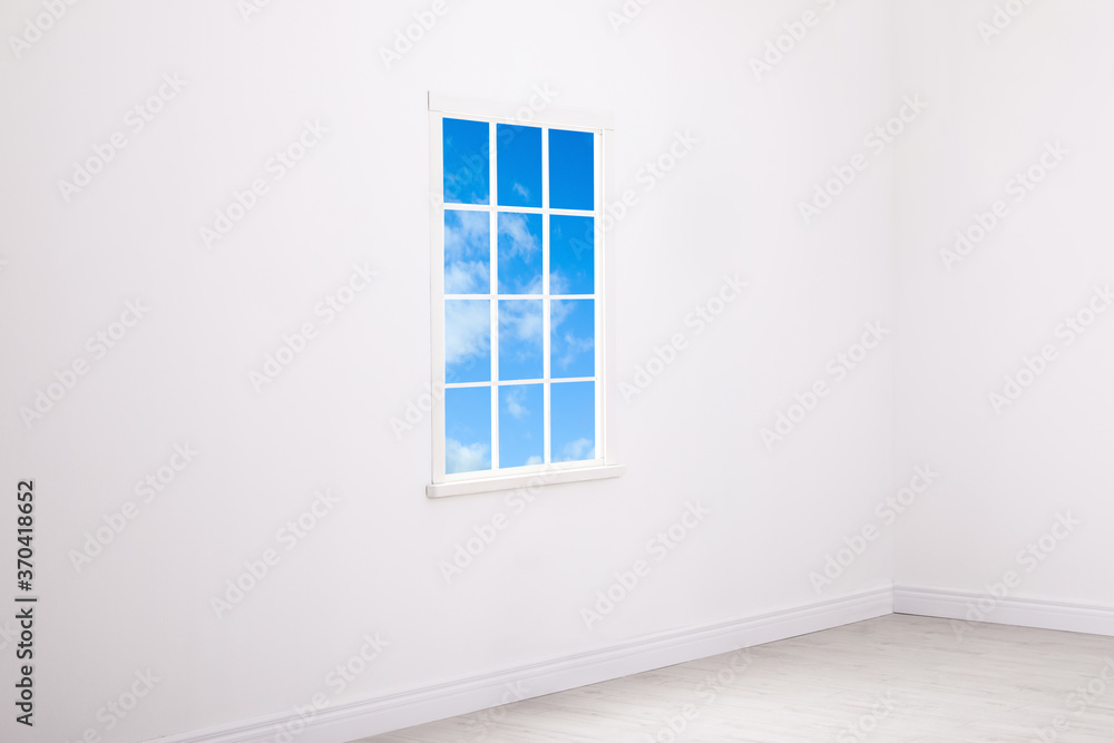 Beautiful view on blue sky with clouds through window in room