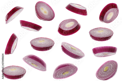 Red onion slices flying on white background