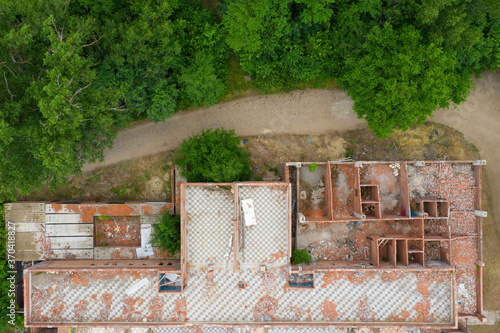 Ruins of the old house, aerial photo. Destroyed building top view.
