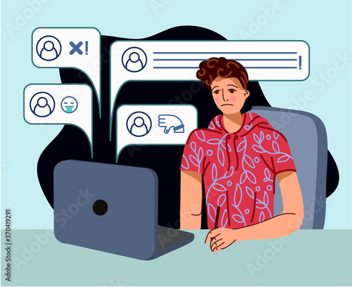 Bullying on the net. The guy is sitting at the computer and getting bad comments. Vector cartoon flat illustration.