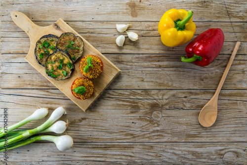 Italian food vegetables of the side dishes including peppers, tomatoes and baked breaded eggplants. . Top view, copy space, mediterranean food photo