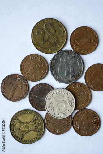 Romanian old metal coins on white background.