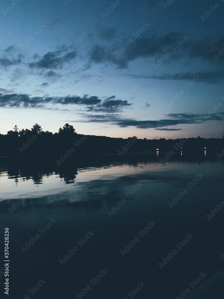 Blue-toned lake and sky scene