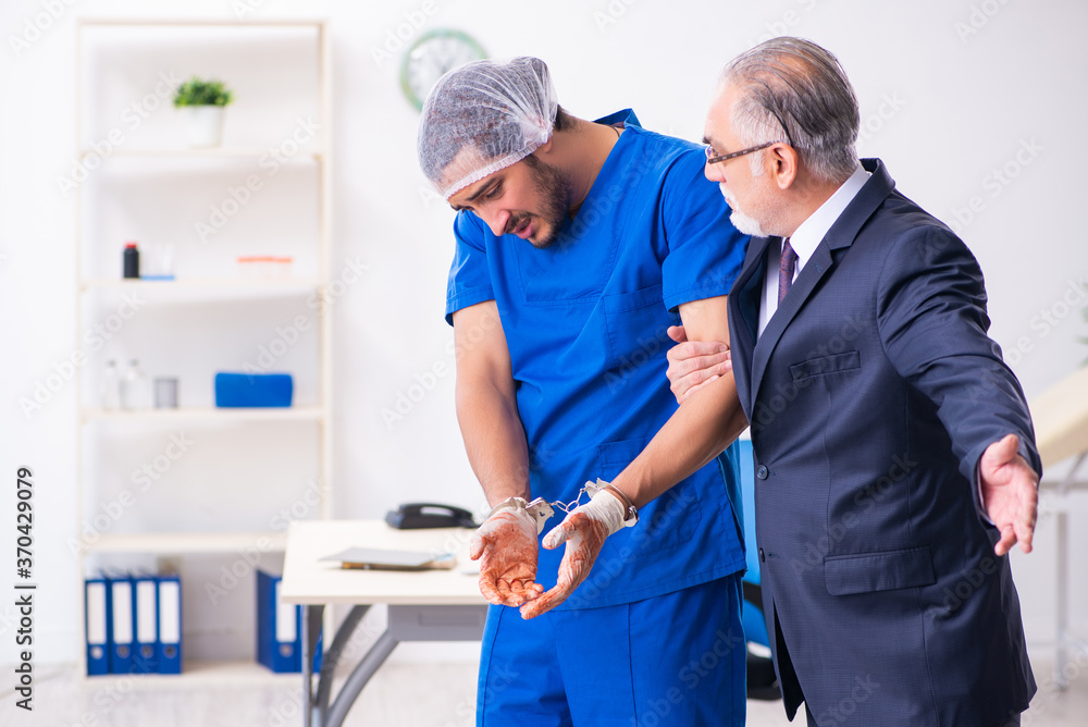 Fototapeta premium Male doctor in courthouse meeting with advocate