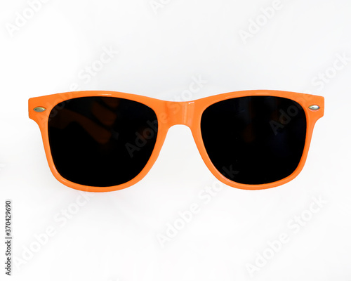 Orange sunglasses on white background