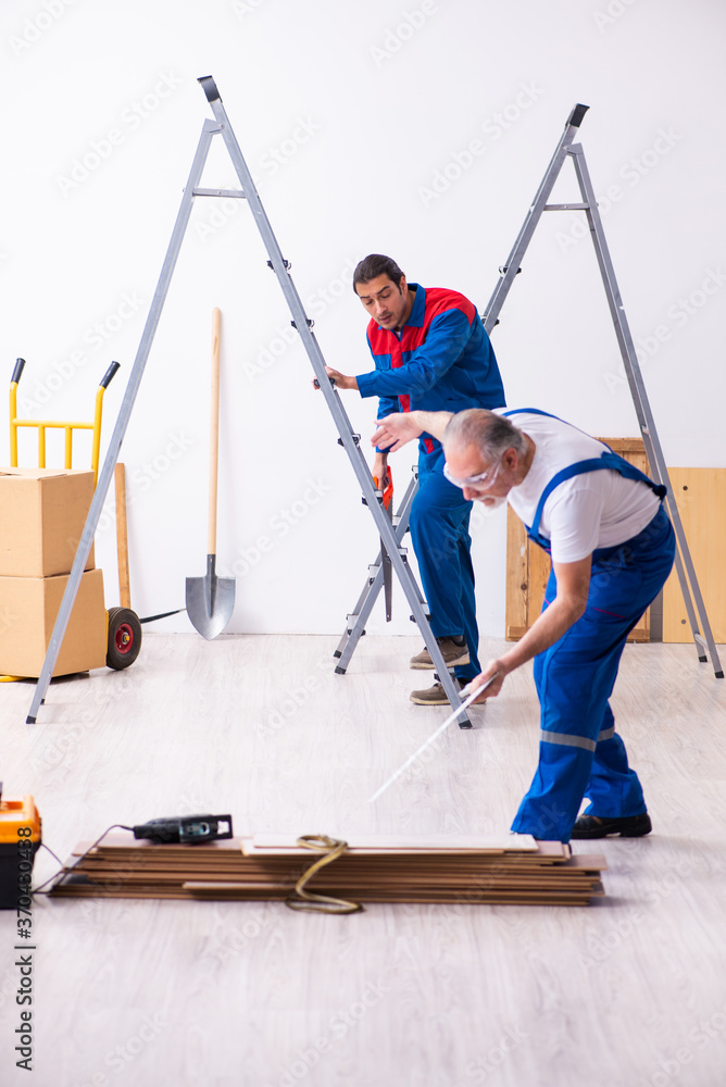 Two contractors and snake indoors Two contractors and snake indoors