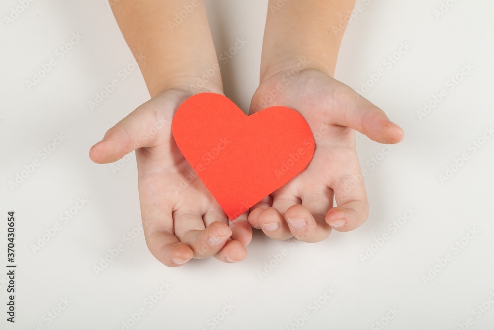 Hands Holding a Paper Heart Hands Holding a Paper Heart