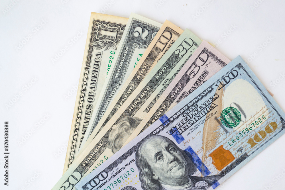 Stack of money American dollar bills on a white background. The concept of buying for dollars Stack of money American dollar bills on a white background. The concept of buying for dollars