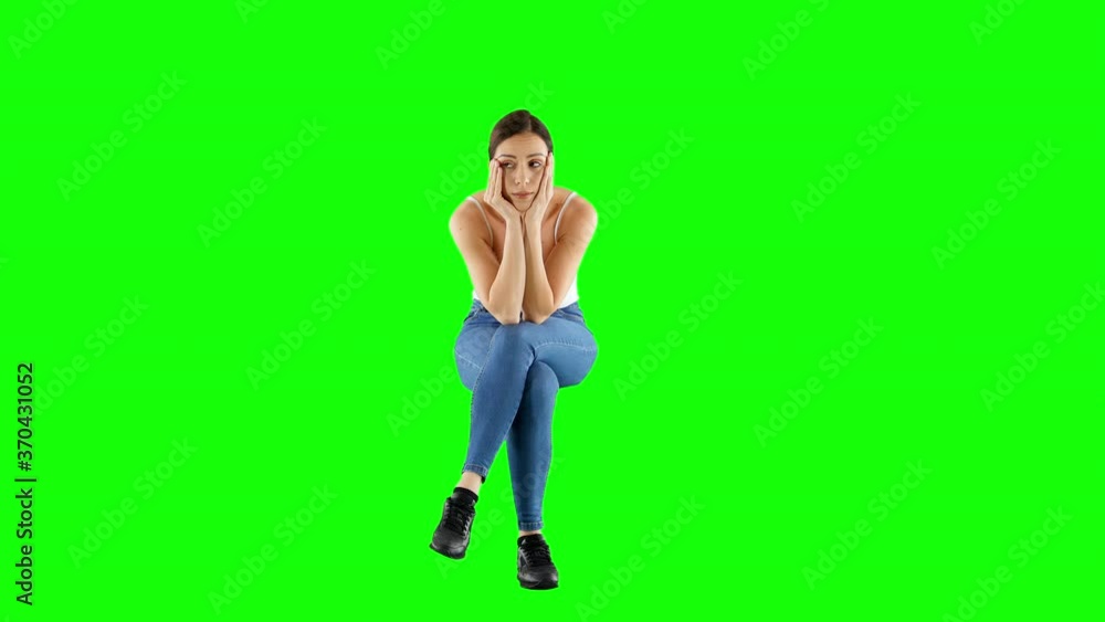 Bored Woman Rests Face on a Hand While Sitting and Waiting on Green Screen Bored Woman Rests Face on a Hand While Sitting and Waiting on Green Screen