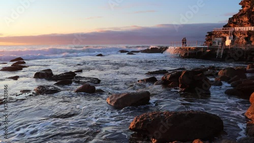 Swimmers jumping to rock pool on Bronte beach in Sydney, Australia – 4k.
