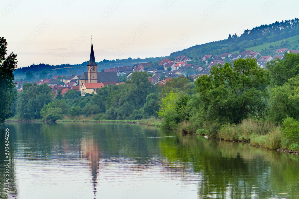 A church in a residential area on the bank of the Main River in Baden-Wurttemberg, Germany