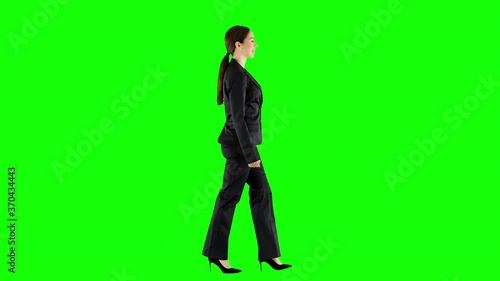 Young Businesswoman Walking Across an Office Wearing Black Suit Green Screen