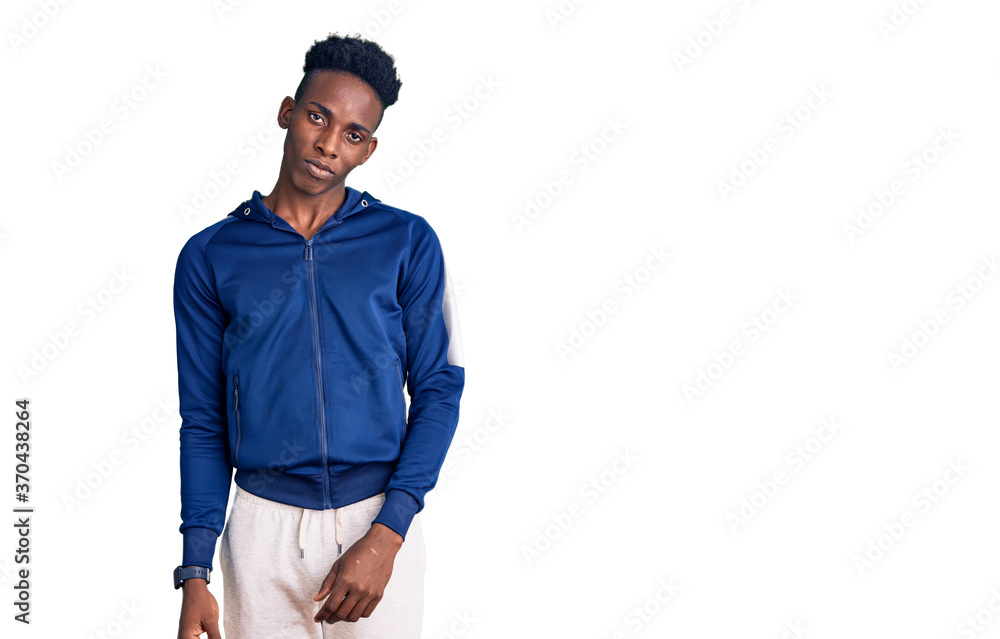 Young african american man wearing sportswear looking sleepy and tired, exhausted for fatigue and hangover, lazy eyes in the morning. Young african american man wearing sportswear looking sleepy and tired, exhausted for fatigue and hangover, lazy eyes in the morning.