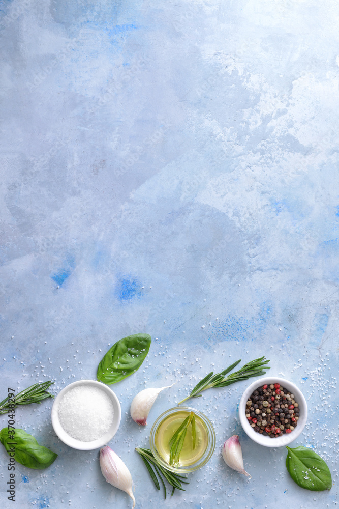 Rosemary oil with spices on color background Rosemary oil with spices on color background