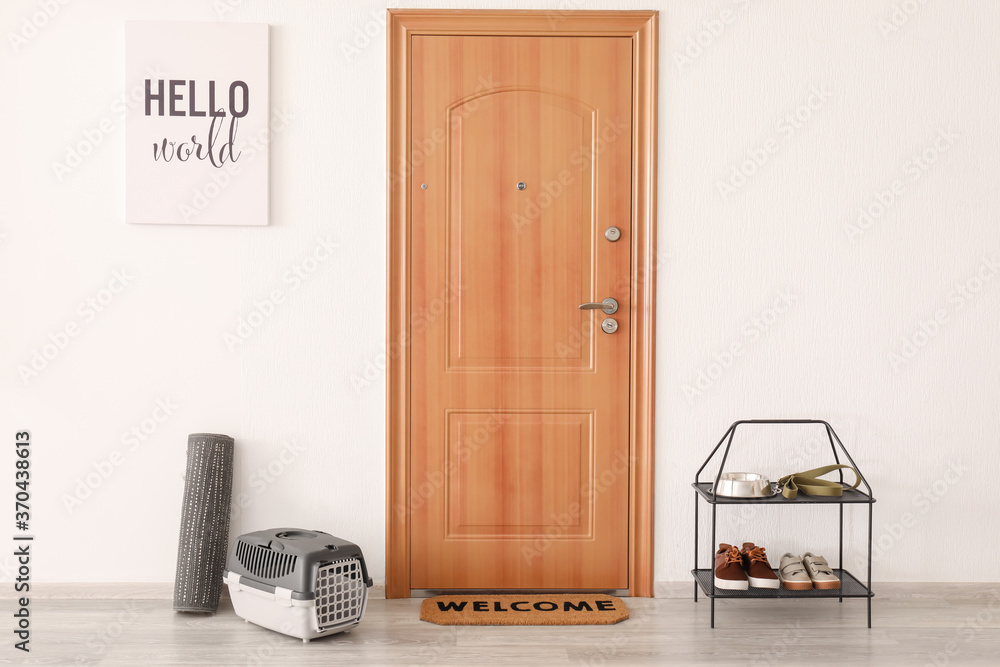Interior of modern stylish hallway with door mat Interior of modern stylish hallway with door mat