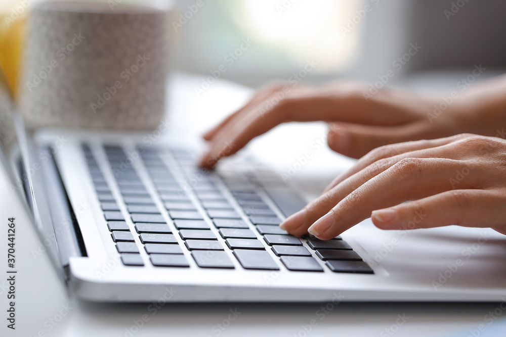 Young woman using laptop for online learning at home Young woman using laptop for online learning at home