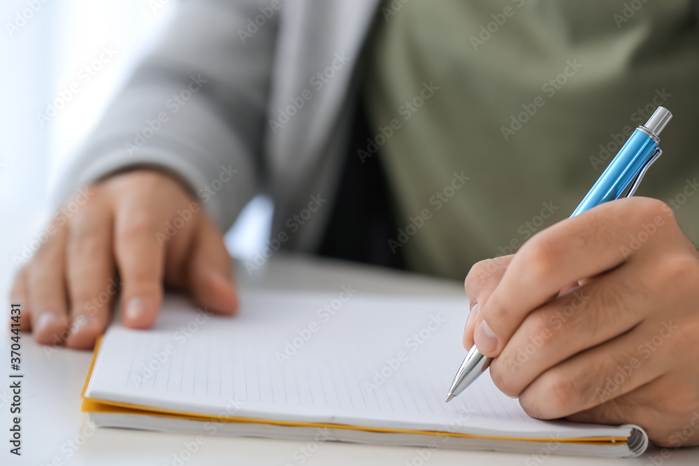 Young man learning at home, closeup Young man learning at home, closeup