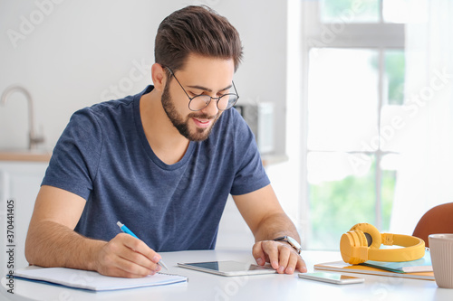 Young man using tablet comp...