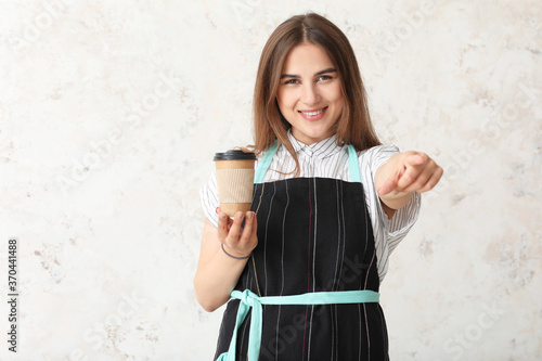 Female barista on light bac...