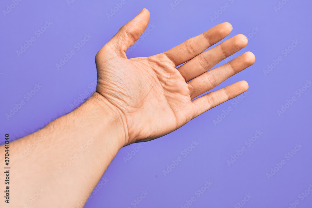 Hand of caucasian young man showing fingers over isolated purple background counting number 5 showing five fingers Hand of caucasian young man showing fingers over isolated purple background counting number 5 showing five fingers