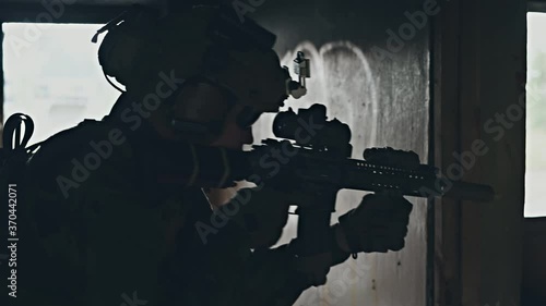 Soldier in combat. Urban combat training, soldier entering abandoned building. Anti terrorist operation battlefield training.