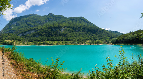 Panorama of Lake Tenno surrounded by Italian mountains with turqoise water © MrsLePew