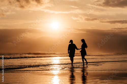 Young couple in love, Attractive man and woman enjoying romantic evening on sunset