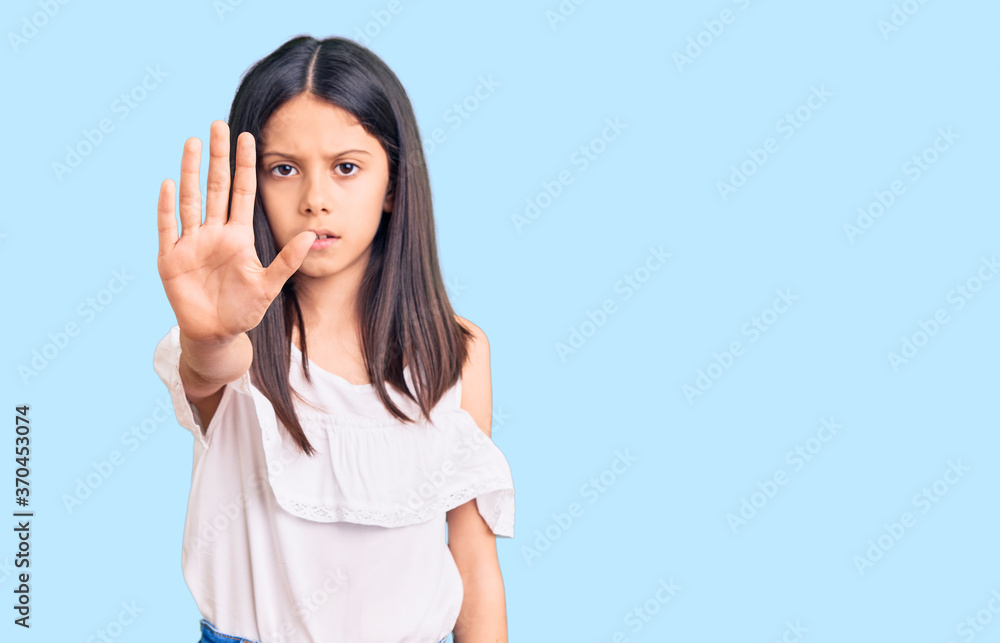 Beautiful child girl wearing casual clothes doing stop sing with palm of the hand. warning expression with negative and serious gesture on the face. Beautiful child girl wearing casual clothes doing stop sing with palm of the hand. warning expression with negative and serious gesture on the face.