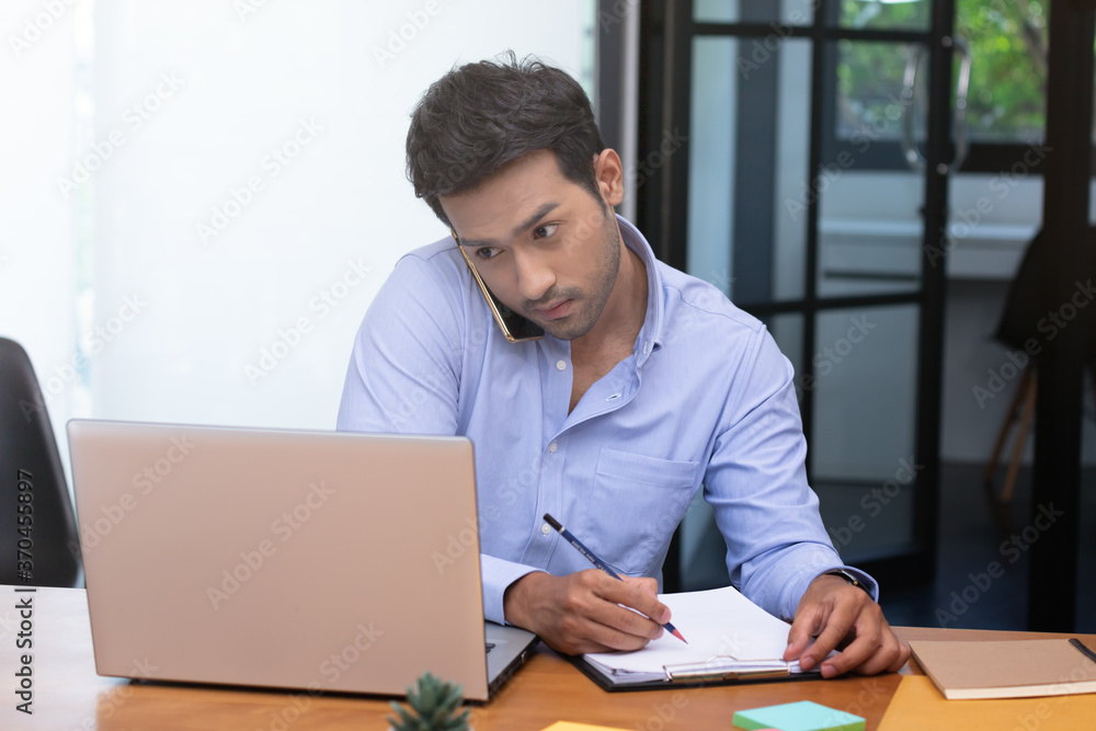 Business asian man happy working job on laptop in office. Business asian man happy working job on laptop in office.