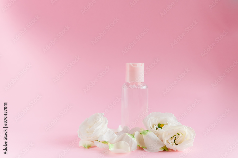 Hand cream with flowers. Delicate skin care concept. Top horizontal view copyspace Hand cream with flowers. Delicate skin care concept. Top horizontal view copyspace