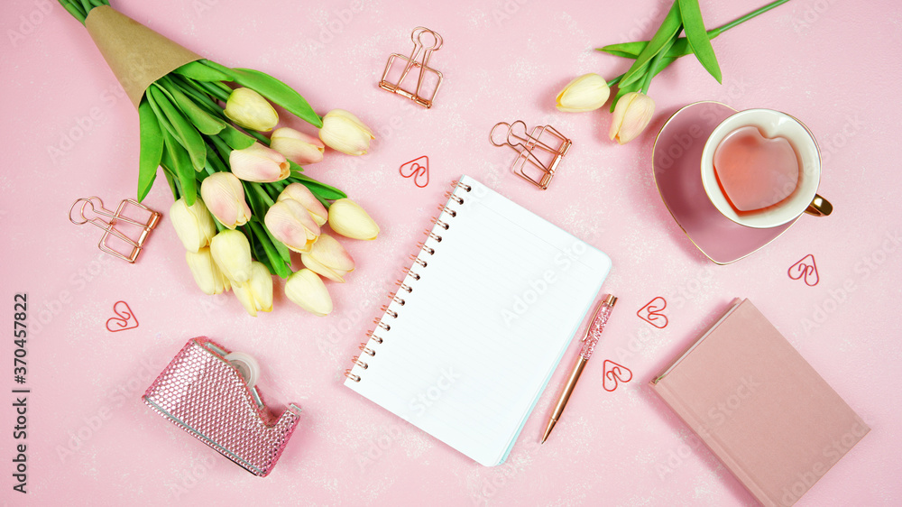 Feminine pink theme desktop workspace with notepad on stylish textured background. Top view blog hero header creative composition flat lay. Feminine pink theme desktop workspace with notepad on stylish textured background. Top view blog hero header creative composition flat lay.