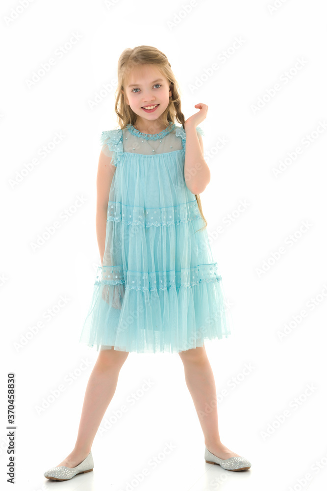 Cute little girl in a light summer dress. Cute little girl in a light summer dress.