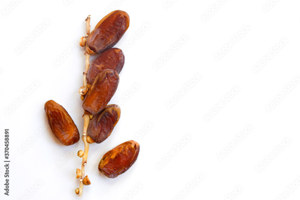 Obraz premium Dates fruit isolated on a white background. Top view. Flat lay pattern.
