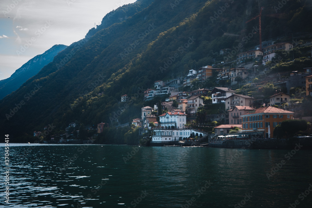 Italian villages built on the steep shores of lake como, Italy.  3