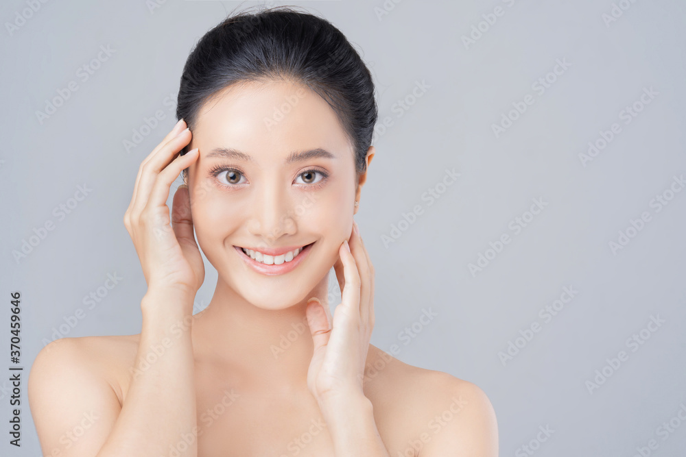 Beautiful female asian face with natural perfect skin in studio portrait Beautiful female asian face with natural perfect skin in studio portrait