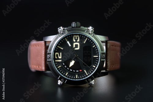 Men's wrist watch on black background