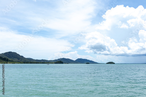 Typical sea in Thailand with blue cloudy sky in normal day.